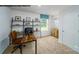 A contemporary home office featuring a desk, shelving unit, and natural light from a window at 578 Sparkleberry St, Chester, SC 29706