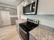 Kitchen featuring gray cabinets, stainless steel appliances, granite countertops and wood-look flooring at 578 Sparkleberry St, Chester, SC 29706