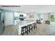 Open concept kitchen with granite counters, white cabinets, stainless appliances, and island seating at 578 Sparkleberry St, Chester, SC 29706