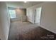 Upstairs loft featuring neutral carpeting, white trim and walls, and an abundance of natural light at 578 Sparkleberry St, Chester, SC 29706