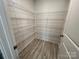 Walk-in pantry with wire shelving and wood-look flooring, offering ample storage at 578 Sparkleberry St, Chester, SC 29706