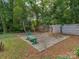Backyard with a basketball hoop and court, perfect for outdoor activities and Gathering fun at 6001 Charing Pl, Charlotte, NC 28211