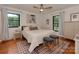 Relaxing bedroom with lots of natural light, hardwood floors and neutral decor at 6001 Charing Pl, Charlotte, NC 28211