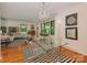Elegant dining room featuring a modern glass table and stylish chandelier at 6001 Charing Pl, Charlotte, NC 28211