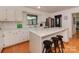 Modern kitchen featuring white cabinetry, quartz countertops and stainless steel appliances at 6001 Charing Pl, Charlotte, NC 28211