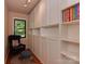 Cozy office space with built in storage, hardwood floors and natural light at 6001 Charing Pl, Charlotte, NC 28211