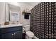 Bathroom with patterned shower curtain, undermount sink, and chrome faucet at 614 West End Dr, Charlotte, NC 28208