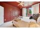 Bedroom with red ceiling and walls, carpet floors, and a wardrobe next to the bed at 614 West End Dr, Charlotte, NC 28208