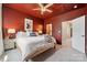 Stylish bedroom featuring a red accent wall and neutral-toned decor for a cozy aesthetic at 614 West End Dr, Charlotte, NC 28208