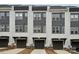 Modern townhome exterior with gray siding and private garages at 614 West End Dr, Charlotte, NC 28208
