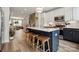 Bright open kitchen with eat-in island and views to living spaces in this modern home at 614 West End Dr, Charlotte, NC 28208