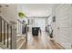 Modern kitchen with an island and seating, stainless appliances, and lots of natural light offers a great living space at 614 West End Dr, Charlotte, NC 28208