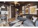 Modern home office with eclectic art, sofa, and wooden desk at 614 West End Dr, Charlotte, NC 28208