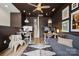 Modern home office with eclectic art, sofa, and wooden desk at 614 West End Dr, Charlotte, NC 28208
