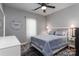 Cozy bedroom featuring a queen bed, ceiling fan, and neutral decor and lots of natural light at 6398 Winding Creek Ln, Denver, NC 28037