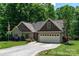 Well-maintained home with a long driveway, two-car garage, beautiful landscaping, and traditional design at 6398 Winding Creek Ln, Denver, NC 28037