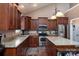 Modern kitchen with granite countertops, stainless steel appliances, and ample cabinet space at 6398 Winding Creek Ln, Denver, NC 28037