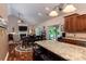 Open kitchen and living space with bar stool seating and stainless steel appliances at 6398 Winding Creek Ln, Denver, NC 28037