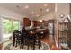 Open kitchen and dining area with hardwood floors, stainless steel appliances, and natural light at 6398 Winding Creek Ln, Denver, NC 28037