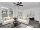 Bright living room with hardwood floors, white sofas, and decorative pillows at 642 Brynwood Dr, Rock Hill, SC 29732