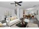 Bright living room with hardwood floors, white sofas, and view of dining area at 642 Brynwood Dr, Rock Hill, SC 29732