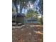 Backyard featuring a carport, metal container for storage, small garage, and fenced area at 66 Arlington Se Ave, Concord, NC 28025