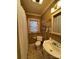 Bathroom featuring a classic white sink, toilet, and shower with tan-colored walls at 66 Arlington Se Ave, Concord, NC 28025