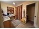 Bathroom with beige tile flooring, curtains, and mirrors above a vanity with a granite countertop at 66 Arlington Se Ave, Concord, NC 28025