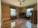 Bedroom with hardwood floors, neutral walls, windows, and a teal chest for added charm at 66 Arlington Se Ave, Concord, NC 28025