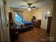 Tranquil bedroom featuring hardwood floors, a ceiling fan, and a cozy window nook at 66 Arlington Se Ave, Concord, NC 28025