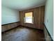 Simple bedroom showcasing neutral walls, trim detail, and a window letting in natural light at 66 Arlington Se Ave, Concord, NC 28025