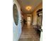 Inviting entryway with tile flooring, soft lighting, and a coat rack, showcasing practicality at 66 Arlington Se Ave, Concord, NC 28025