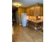 Bright kitchen featuring granite countertops, wooden cabinets, and an eat-in counter with barstool seating at 66 Arlington Se Ave, Concord, NC 28025