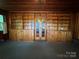 Stylish room boasting built-in wooden shelves and a charming view through the glass-paneled doors at 66 Arlington Se Ave, Concord, NC 28025