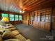 Cozy living room with wooden ceiling and walls, built-in bookshelves, and comfortable seating at 66 Arlington Se Ave, Concord, NC 28025