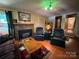 Inviting living room featuring a cozy fireplace and classic hardwood floors at 66 Arlington Se Ave, Concord, NC 28025
