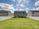 Spacious backyard featuring a well-manicured lawn and white picket fence, perfect for outdoor activities at 665 Pointe Andrews Dr, Concord, NC 28025