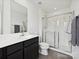 Bathroom featuring a shower with glass doors and a modern vanity at 665 Pointe Andrews Dr, Concord, NC 28025