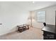 Neutral bedroom with carpeted floors and a desk at 665 Pointe Andrews Dr, Concord, NC 28025