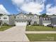 Charming two-story home with a well-manicured lawn, attached garage, and lovely curb appeal at 665 Pointe Andrews Dr, Concord, NC 28025
