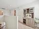 Bright hallway featuring carpeted floors and a wooden hutch at 665 Pointe Andrews Dr, Concord, NC 28025