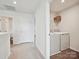 Bright laundry room includes a modern washer and dryer set with storage shelf at 665 Pointe Andrews Dr, Concord, NC 28025
