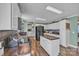 Bright kitchen with white cabinets, butcher block countertops, and a center island at 725 Hunters Ridge Rd, Taylorsville, NC 28681