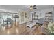 Open-concept layout flows from living room to dining area featuring hardwood flooring at 725 Hunters Ridge Rd, Taylorsville, NC 28681
