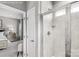 Ensuite bathroom with glass shower and neutral colored tile at 7631 Griffins Gate Sw Dr, Concord, NC 28025