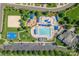 Aerial view of neighborhood amenities including swimming pool, playground, beach volleyball and a basketball court at 7711 Kelburn Ln, Charlotte, NC 28273