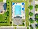 Overhead view of a community pool surrounded by lounge chairs and landscaping at 7711 Kelburn Ln, Charlotte, NC 28273
