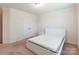 Cozy bedroom featuring neutral walls, large window, and plush carpeting at 7711 Kelburn Ln, Charlotte, NC 28273