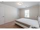 Cozy bedroom featuring neutral walls, large window, and plush carpeting at 7711 Kelburn Ln, Charlotte, NC 28273