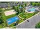 A view of the community amenities including a beach volleyball court, playground, pool, and basketball court at 7711 Kelburn Ln, Charlotte, NC 28273